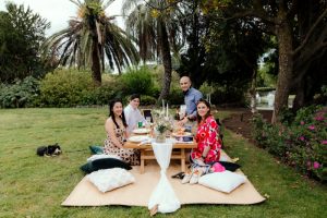 Guest enjoy micro-wedding picnic in a park